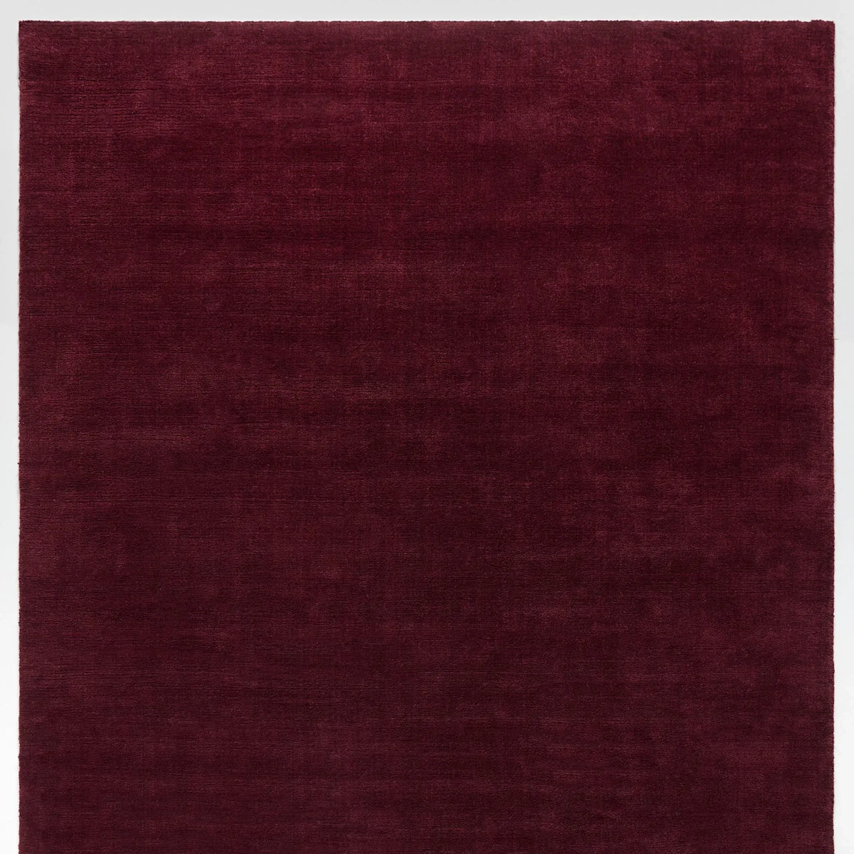iconbydesign-freya-nz-wool-rug-berry-red--SHARED--studio-a_flatlay.webp