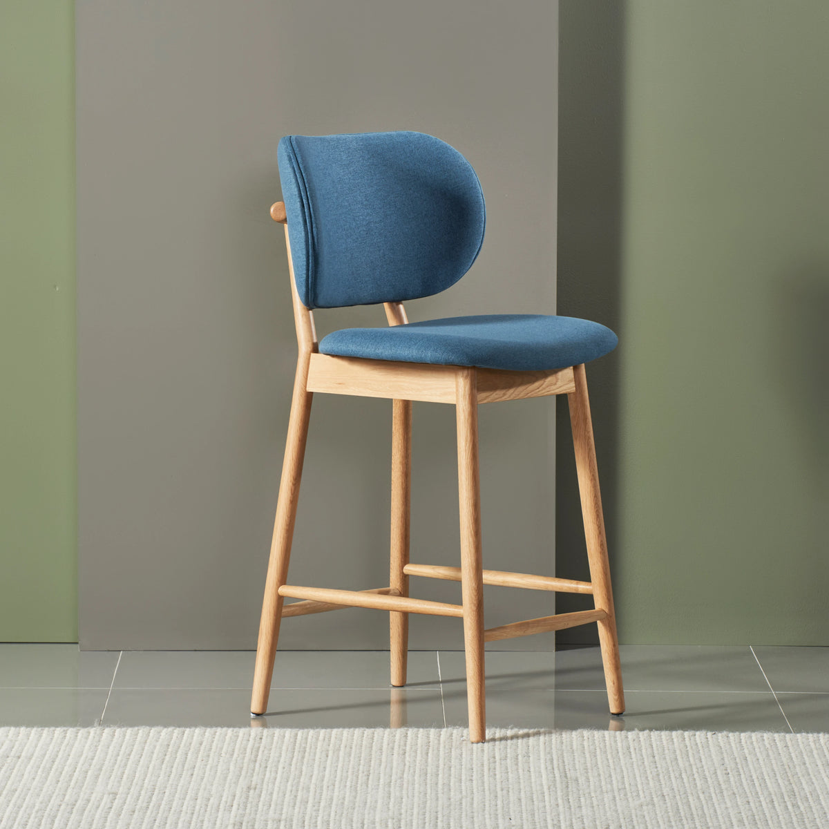iconbydesign-olivia-bar-stool-oak-denim-blue-fabric--DF6MA1--studio-d_shot-front-right.webp